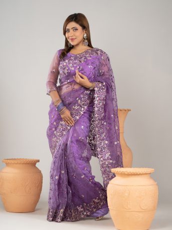 ইমপোর্টেড বেগুনী কালার ওয়েটলেস সফট অরগাঞ্জা ফেব্রিকের মধ্যে গর্জিয়াস এমব্রয়ডারি করা পার্টি শাড়ি