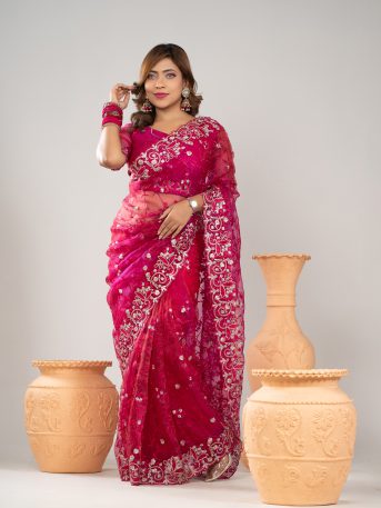 ইমপোর্টেড রানী কালার ওয়েটলেস সফট অরগাঞ্জা ফেব্রিকের মধ্যে গর্জিয়াস এমব্রয়ডারি করা পার্টি শাড়ি