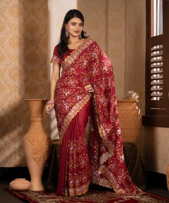 ইমপোর্টেড মেরুন কালার ওয়েটলেস সফট চিনিগুড়া সিল্ক ফেব্রিক এর মধ্যে গর্জিয়াস এমব্রয়ডারি কাজ করা পার্টি শাড়ি।